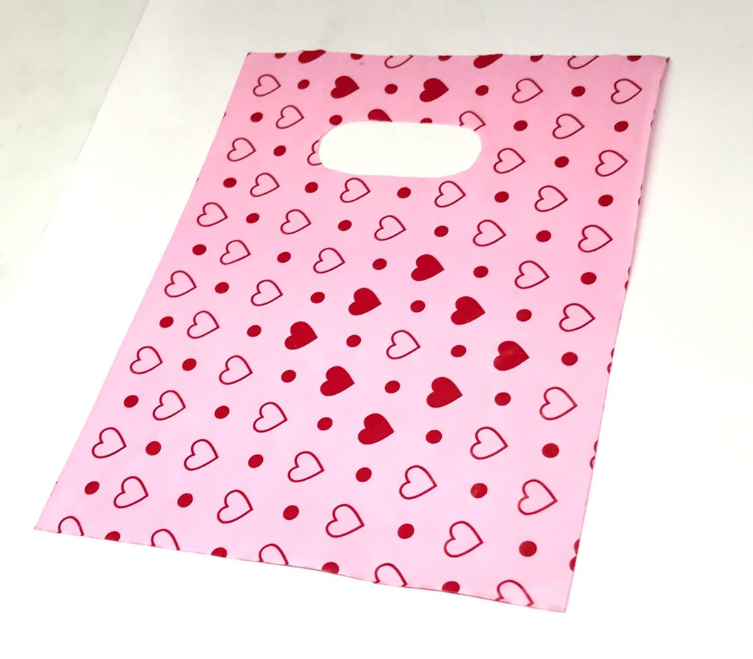 BOLSAS PLASTICAS ROSA CON CORAZONES | 13.5MM X 18MM | 100 UNDS