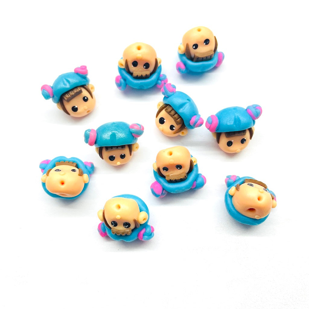 Cabezas de fimo | 18mm | Niña gorrito celeste y rosa | 6und